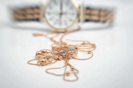 Accessories and jewelry for a fashionable girl : gold ring, necklace and original wristwatchの写真素材