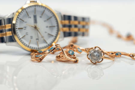 Accessories and jewelry for a fashionable girl : gold ring, necklace and original wristwatchの写真素材