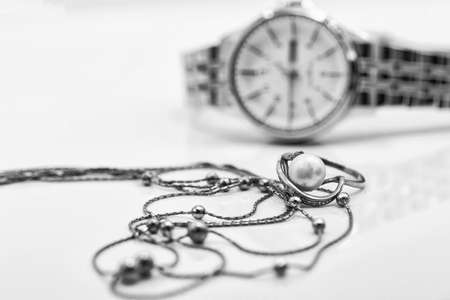 Accessories and jewelry for a fashionable girl : gold ring, necklace and original wristwatchの写真素材