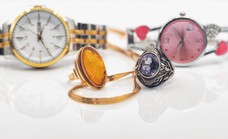 Two sets of accessories for women: different watches and jewelryの写真素材