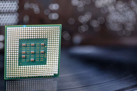 A giant leap in technology between recording on vinyl records and the creation of computer processorの写真素材