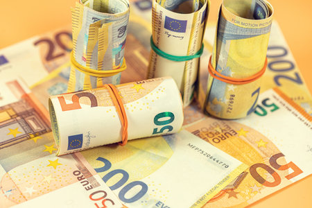 Background of twisted and scattered Euro banknotesの写真素材