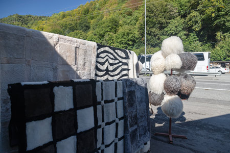 Souvenirs made of sheep wool: hats, rugs and bedding. Selling souvenirs in the roadside shopの写真素材