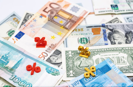 Mathematical symbols of interest lie on top of the banknotes