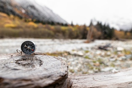 A compass against the background of nature, symbolizing the search for a way and harmony with the outside worldの写真素材