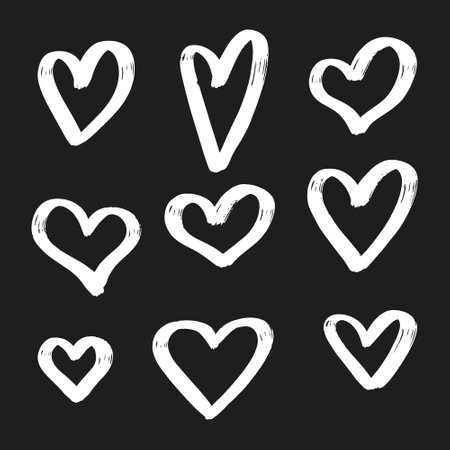 Hand drawn heart icon set. Vector illustration isolated on black background.のイラスト素材