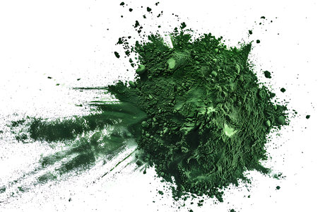 A green dry spinach powder on a white backgroundの素材