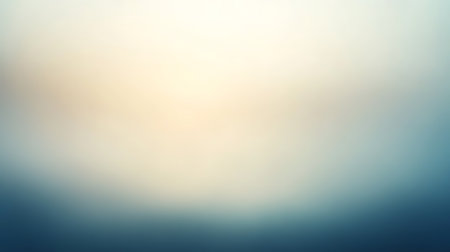 Abstract blurred gradient background displaying a soft light creamy yellow seamlessly transitioning into cool, calming dark blue tones, ideal for modern graphic designs or web use.の素材