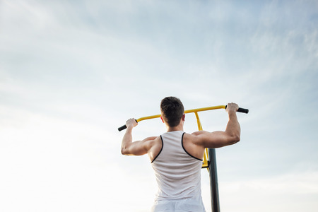 Man do workout at stadium area with sunshine background