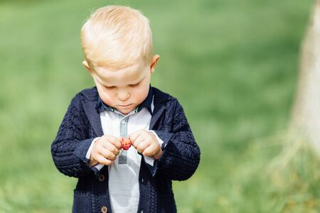 Little boy do bubbles with his mother at park backgroundの写真素材