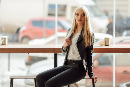 Pretty girl in coffee place look at the camera and smile, costumerの写真素材