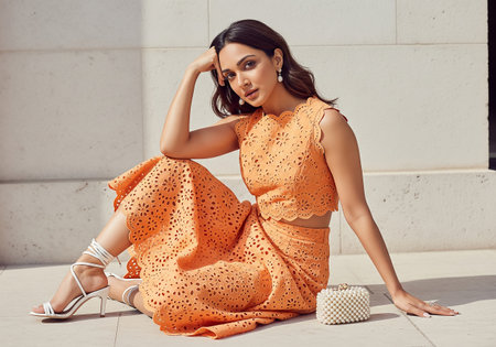 fashion outdoor photo of beautiful sensual woman with dark hair in elegant dress and accessories posing in summer cityの素材