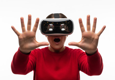 Woman wearing virtual reality goggles on a white background. Virtual reality conceptの素材