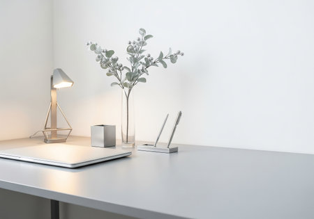 Laptop and lamp on white table in office. 3d renderingの素材