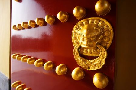 A traditional red door at Temple of Heaven in Beijing, China.の写真素材