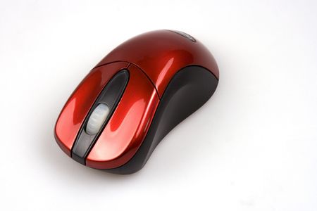 A red wireless computer mouse over white background.の写真素材