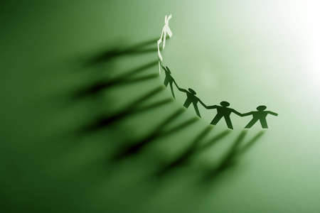 Group of male paper chain representing teamwork.の写真素材