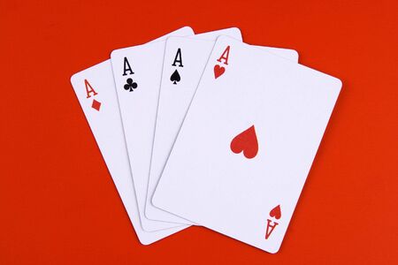Cards of four aces in red background.の写真素材