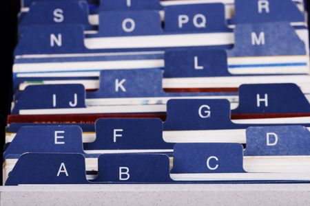 Close up of desktop business card index holder.の写真素材