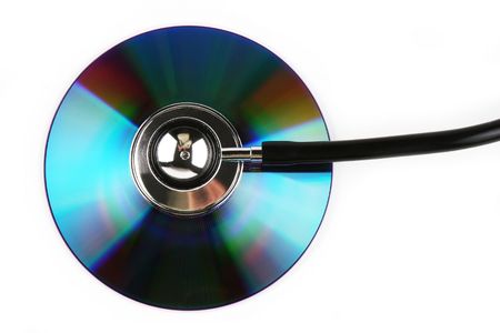 A stethoscope and a compact disk in white background.の写真素材
