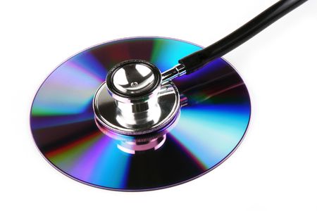 A stethoscope and a compact disk in white background.の写真素材