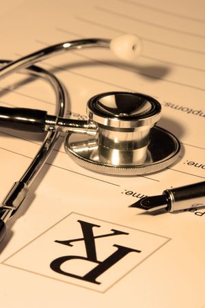A Stethoscope over a medical report form.