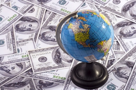 A globe with chinese wording over US dollar.のeditorial素材