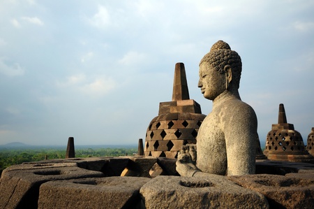 Buddha statue in stupa. Borobudur. Java. Indonesia  