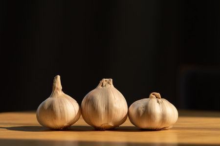 The garlic on wooden backgroundの写真素材