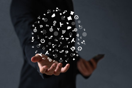 Business man  seek digital and techology icon floating on screenの写真素材