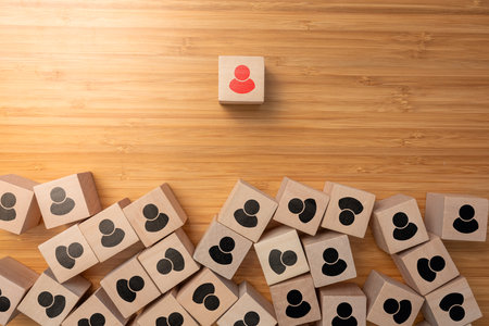 A cube wooden box arrange on wooden surface, teamwork and leader in success business concept.の写真素材