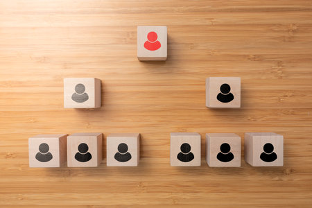 A cube wooden box arrange on wooden surface, teamwork and leader in success business concept.の写真素材