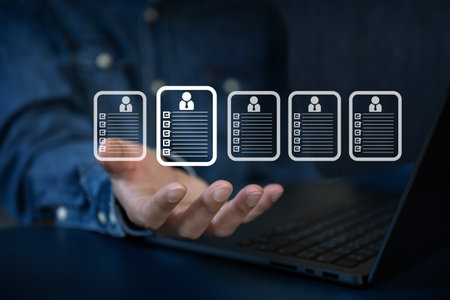 The Business man seek data to find a human data which are floating on screenの写真素材