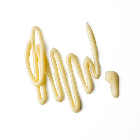 photo of Mayonnaise squeezed onto a white background, high resolution image take photo from 45MP camera.の写真素材