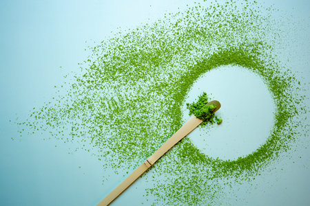 Matcha green tea on a pastel green background, shot in still life style.の写真素材