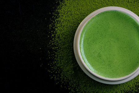 Matcha green tea on a dark background, shot in still life style.