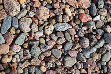 Texture of multi-colored granite stones. Background