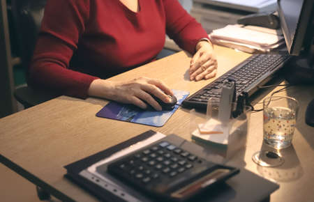 female hands with mouse keyboard and computer on the table. Workspaceの写真素材