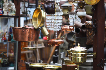 Various antiques, old vintage objects and furniture for sale at a flea market.の写真素材