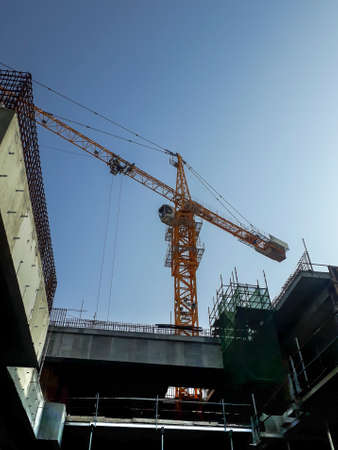 Doha, Qatar- Undergoing project construction works in middle east country- Qatar showing overhead cranes, buildings, tower cranes and other building structures and materials.の写真素材