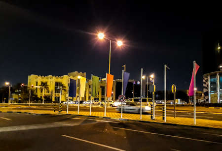 Doha, Qatar - October 26, 2018: A part of a Doha city with modern architecture and traffic at evening in the frame.のeditorial素材