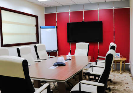 Doha, Qatar- October 29 2018: Interior view of an office building with lights, cubicle, chairs, display, glasses and tables.のeditorial素材