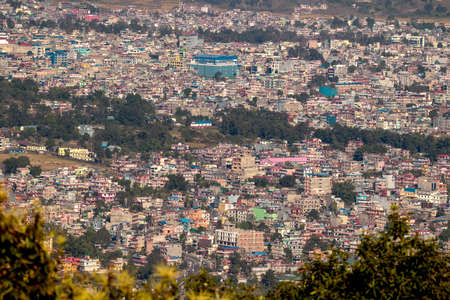 Pokhara, Nepal- November 15 2019: Aerial view of densely populated area of Pokhara city showing residential buildings. Unplanned urbanization and development.のeditorial素材