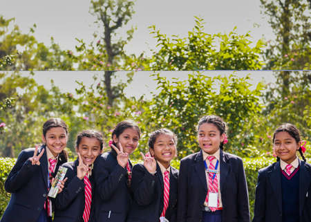 Happy school children posing for camera during their field-visit. School students on their educational tour.のeditorial素材