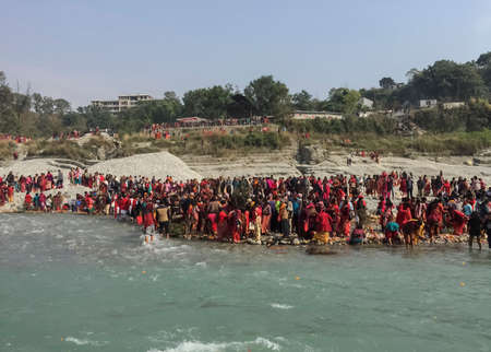 Hindu devotees worshiping  the gods and goddess and performing the hindu rituals at the bank of Ganga river in Pokhara, Nepal.のeditorial素材