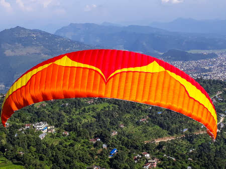 Paragliders ready to take off from the hill for paragliding in the Pokhara valley of Nepal.の写真素材