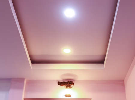 Modern interior design for living room, conference room and hotels. False ceiling co-ply design using gypsum or plaster of paris. Illuminated new home interior with false ceiling lighs.の写真素材