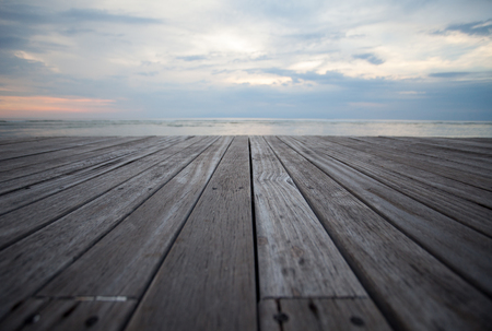 Close up old wooden flooring and tropical beachの写真素材