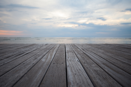 Close up old wooden flooring and tropical beachの写真素材