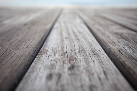 Close up old wooden flooring and tropical beachの写真素材